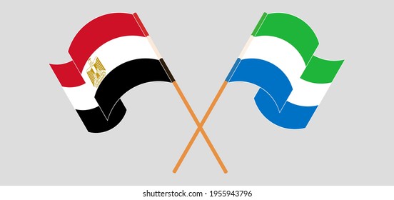 Crossed and waving flags of Egypt and Sierra Leone