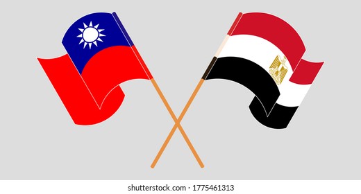 Crossed and waving flags of Egypt and Taiwan