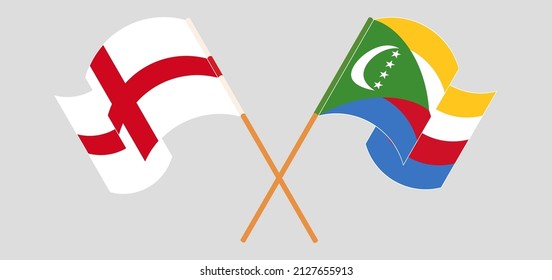 Banderas cruzadas y ondeando banderas de Inglaterra y Comoras. Ilustración del vector
