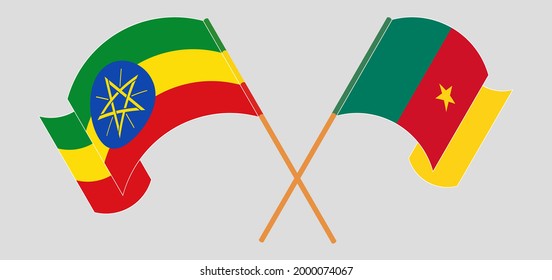 Crossed and waving flags of Ethiopia and Cameroon