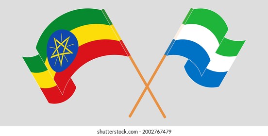 Crossed and waving flags of Ethiopia and Sierra Leone