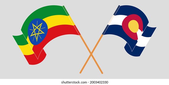 Crossed and waving flags of Ethiopia and The State of Colorado
