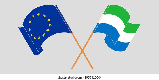 Crossed and waving flags of the European Union and Sierra Leone