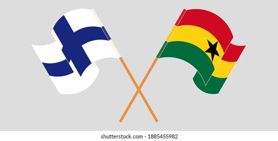 Crossed and waving flags of Finland and Ghana