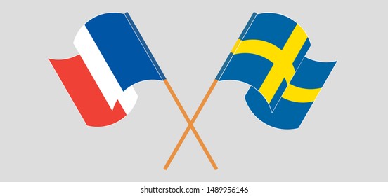 Crossed and waving flags of France and Sweden