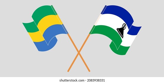 Crossed and waving flags of Gabon and Kingdom of Lesotho. Vector illustration
