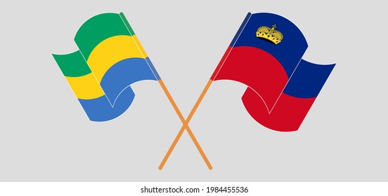 Crossed and waving flags of Gabon and Liechtenstein
