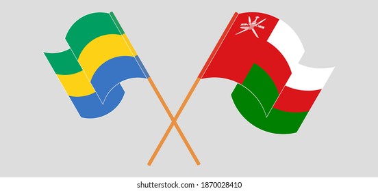 Banderas cruzadas y ondeando banderas de Gabón y Omán