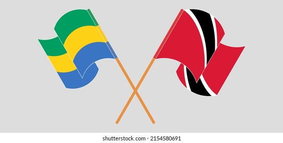 Crossed and waving flags of Gabon and Trinidad and Tobago. Vector illustration

