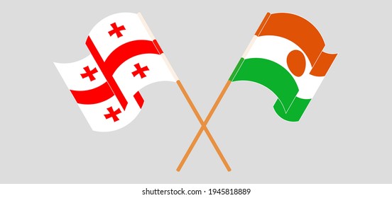 Banderas cruzadas y ondeando banderas de Georgia y Níger