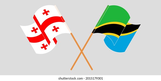 Crossed and waving flags of Georgia and Tanzania