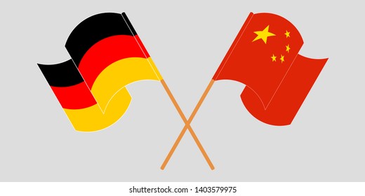 Crossed and waving flags of Germany and China