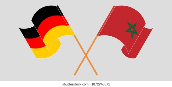 Crossed and waving flags of Germany and Morocco