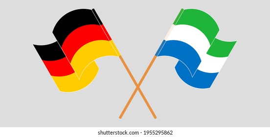 Crossed and waving flags of Germany and Sierra Leone