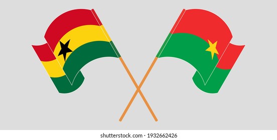Crossed and waving flags of Ghana and Burkina Faso