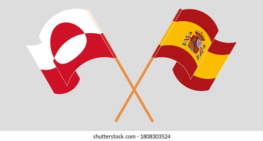 Crossed and waving flags of Greenland and Spain
