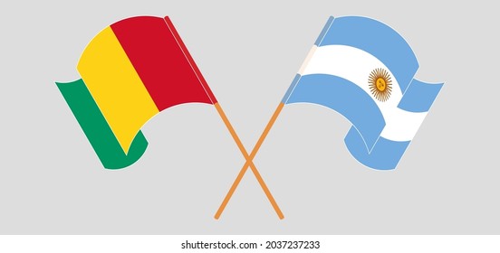 Crossed and waving flags of Guinea and Argentina