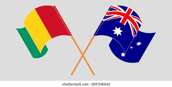 Crossed and waving flags of Guinea and Australia