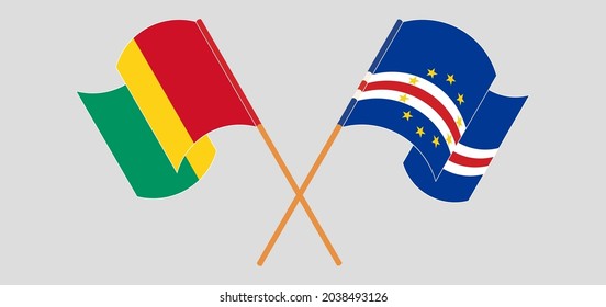 Crossed and waving flags of Guinea and Cape Verde