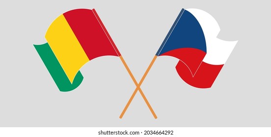 Banderas cruzadas y ondeando banderas de Guinea y la República Checa