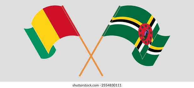 Crossed and waving flags of Guinea and Dominica. Vector illustration.