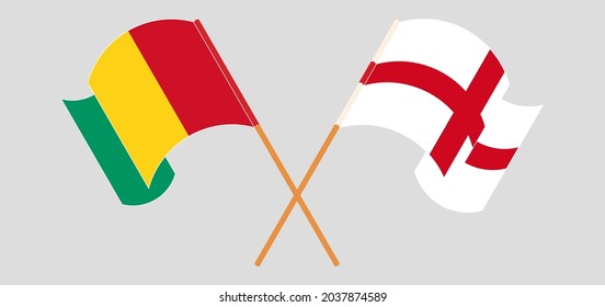 Crossed and waving flags of Guinea and England