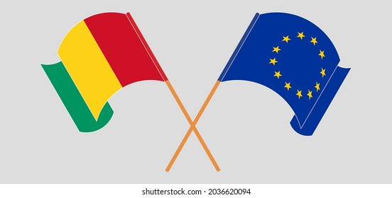 Crossed and waving flags of Guinea and the EU
