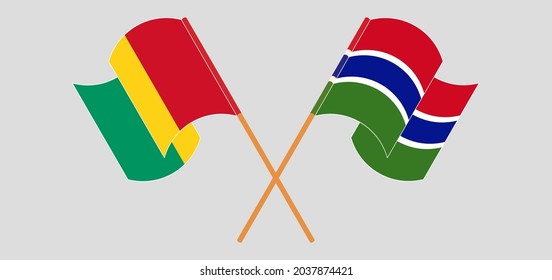Crossed and waving flags of Guinea and the Gambia