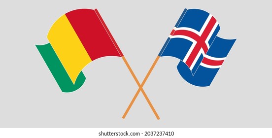 Crossed and waving flags of Guinea and Iceland