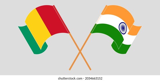 Crossed and waving flags of Guinea and India