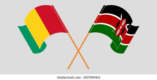 Cruzados y ondeando banderas de Guinea y Kenia