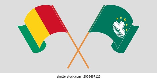 Banderas cruzadas y ondeando banderas de Guinea y Macao