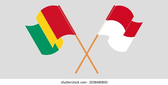 Crossed and waving flags of Guinea and Monaco