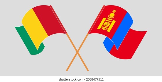 Crossed and waving flags of Guinea and Mongolia