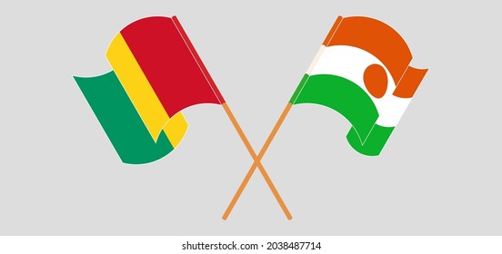 Crossed and waving flags of Guinea and Niger