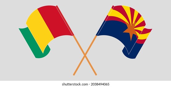 Banderas cruzadas y ondeando banderas de Guinea y del estado de Arizona