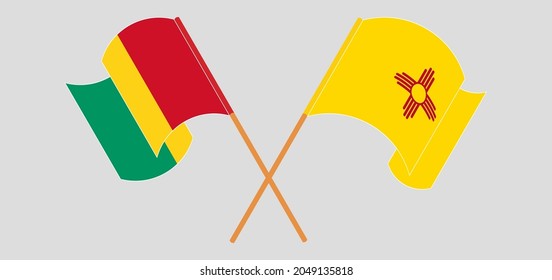 Crossed and waving flags of Guinea and the State of New Mexico