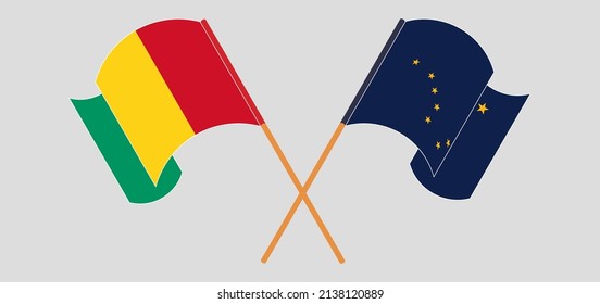 Crossed and waving flags of Guinea and the State of Alaska. Vector illustration
