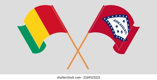 Crossed and waving flags of Guinea and The State of Arkansas. Vector illustration

