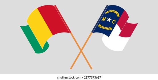 Crossed and waving flags of Guinea and The State of North Carolina. Vector illustration
