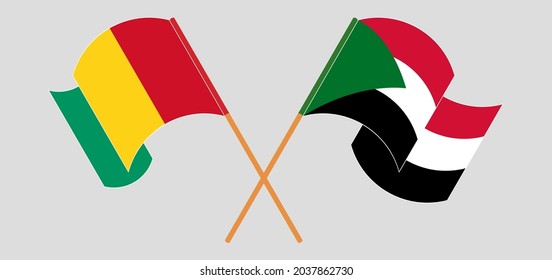 Crossed and waving flags of Guinea and the Sudan