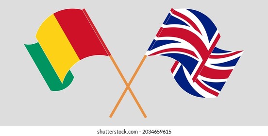 Crossed and waving flags of Guinea and the UK