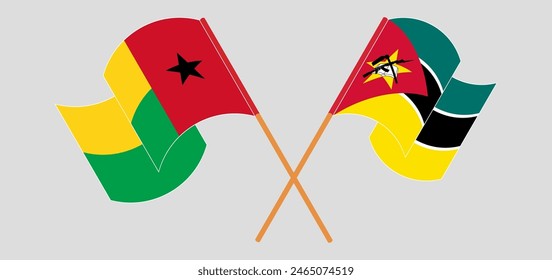 Crossed and waving flags of Guinea-Bissau and Mozambique. Vector illustration
