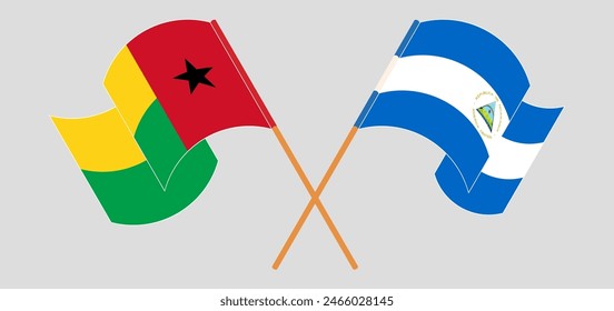 Crossed and waving flags of Guinea-Bissau and Nicaragua. Vector illustration
