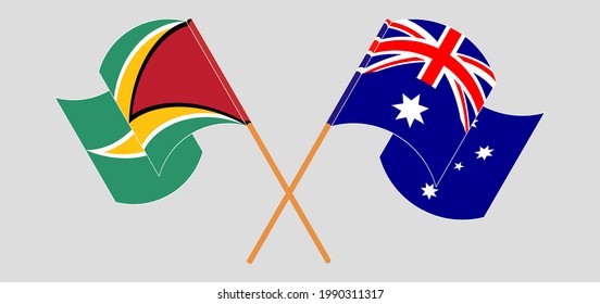 Crossed and waving flags of Guyana and Australia