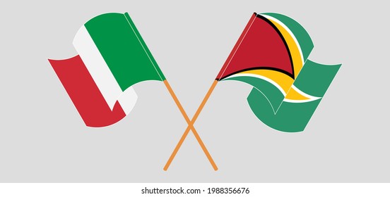 Crossed and waving flags of Guyana and Italy