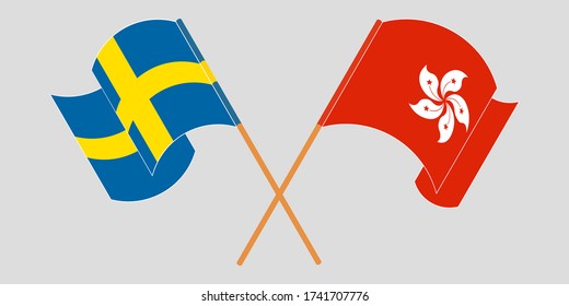 Crossed and waving flags of Hong Kong and Sweden
