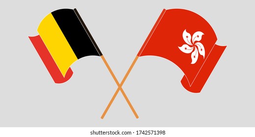 Banderas cruzadas y ondeando banderas de Hong Kong y Bélgica