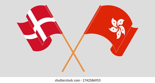 Crossed and waving flags of Hong Kong and Denmark