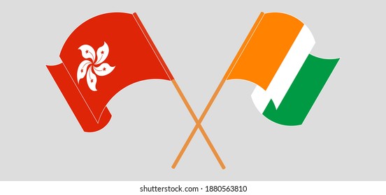 Crossed and waving flags of Hong Kong and Republic of Ivory Coast